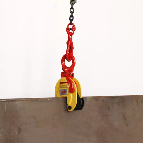 Industrial Vertical Plate Lifting Clamp DSQ Type hanging against a concrete wall.