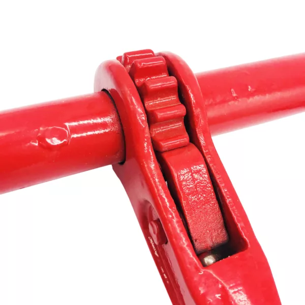 Close-up of a red pipeline with a Ratchet Load Binder with Grab Hook and Pins, EN2195-3 Standard coupling joint.