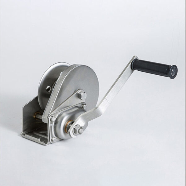 Stainless steel hand winch with black handle on a white background.