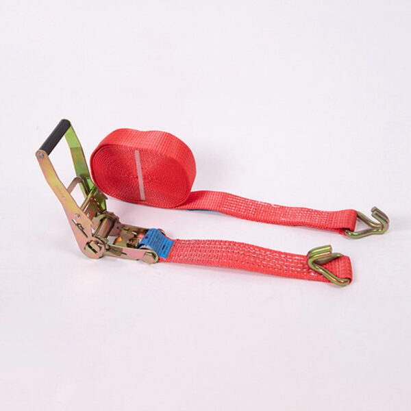 A red 2" LC 2500kg Ergo Ratchet Strap with metal hooks and a ratchet is coiled, partially unrolled on a white background.