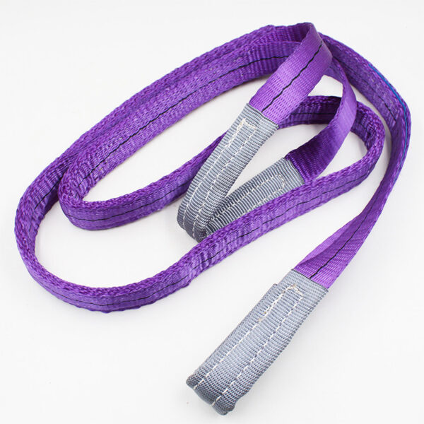 The 1T Synthetic Webbing Sling, purple with reinforced gray loops, is neatly coiled on a white background.