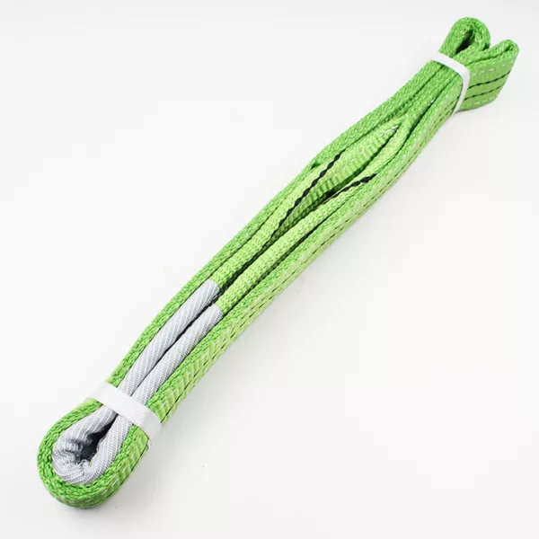 Coiled 2T Flat Webbing Sling with a reinforced loop end on white background.