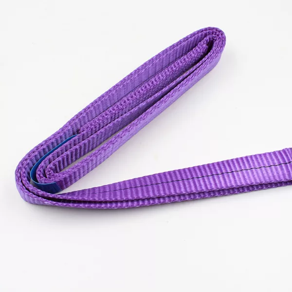 A rolled-up purple 1T Custom Endless Webbing Sling on a white background.