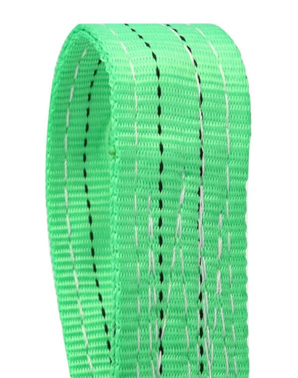 Close-up of a green 2T polyester flat webbing sling with black and white stitching.