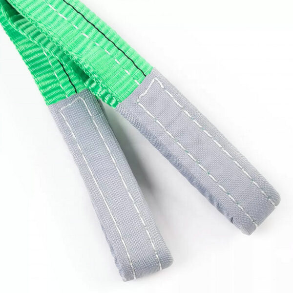 Close-up of a 2T Polyester Flat Webbing Sling with green material, grey padding, and white stitching.