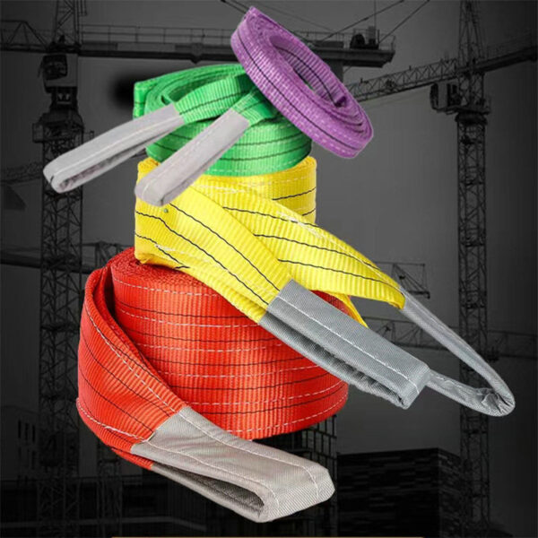 Vibrant double-ply webbing slings stacked against a dark crane-silhouetted backdrop.