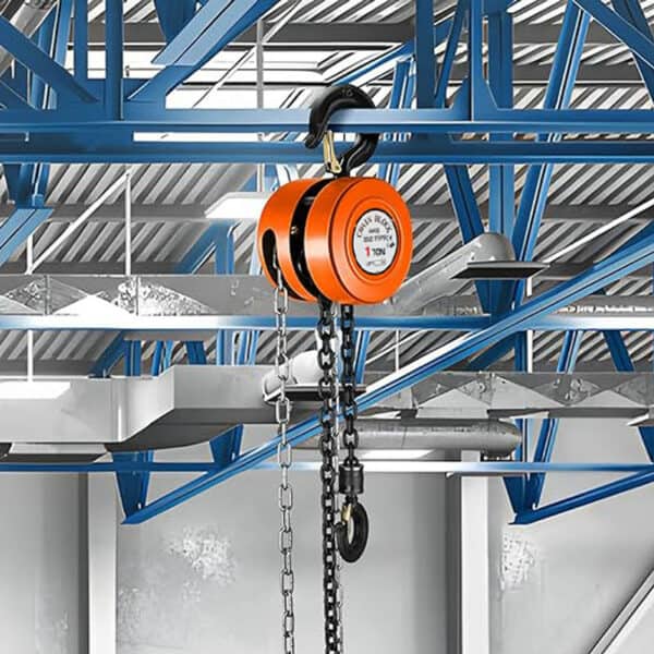 An orange 1-ton manual chain hoist hangs from a blue steel beam in an industrial setting.