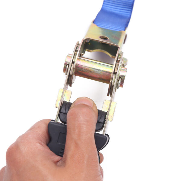 A hand skillfully uses a Tie Down Buckle Set to secure the blue tie down to the buckle.