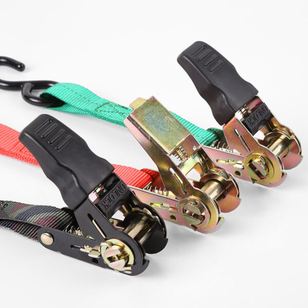 A Tie Down Buckle Set with three colorful ratchet straps, sturdy buckles, and black rubber grips is shown on a white surface.